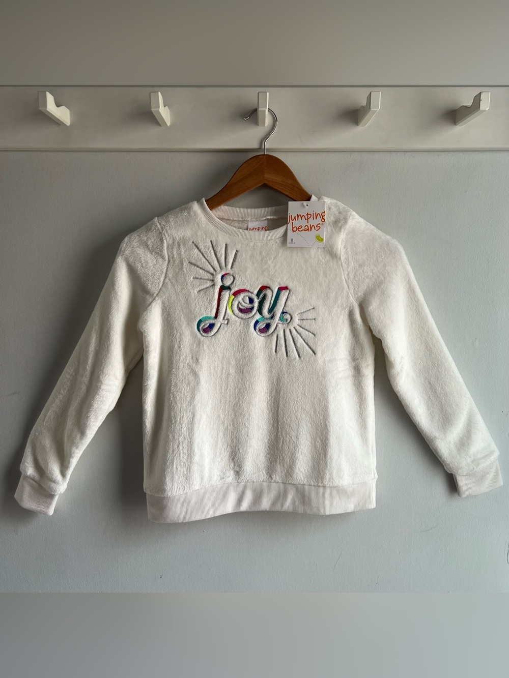 Jumping Beans Girl’s Size 8 Joy Graphic White Long Sleeve Plush Sweatshirt NWT